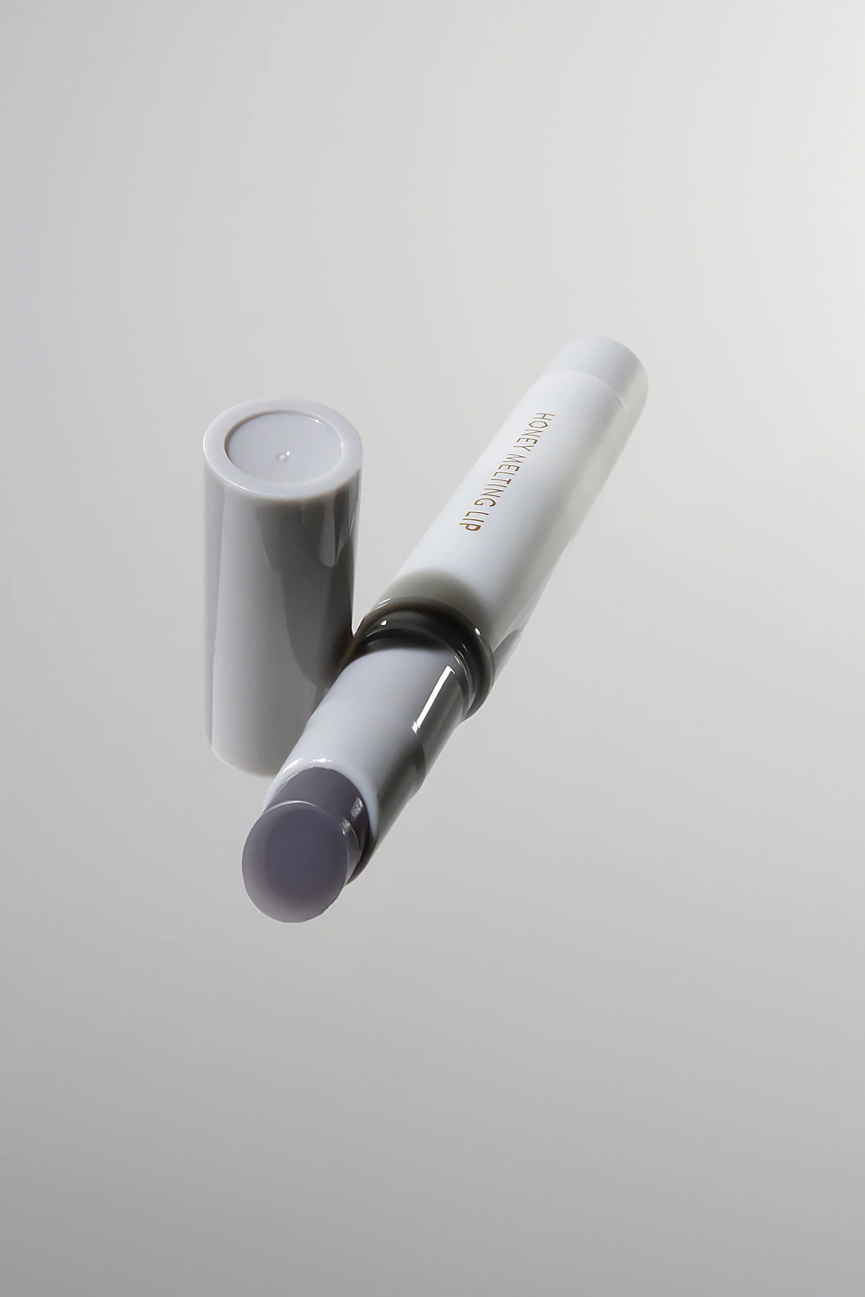 Honey Melting Lip 12 Mood Plumping - Luciu de buze cu efect de volum - HER